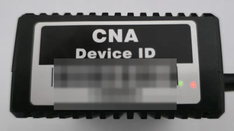 The back of a CNA sensor: the CNA Device ID label, and a green and a red status light at its bottom right.